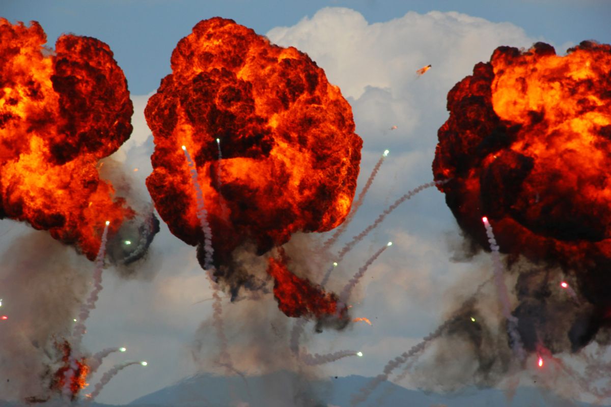 Large explosion made by fire bomb drops at an airshow display