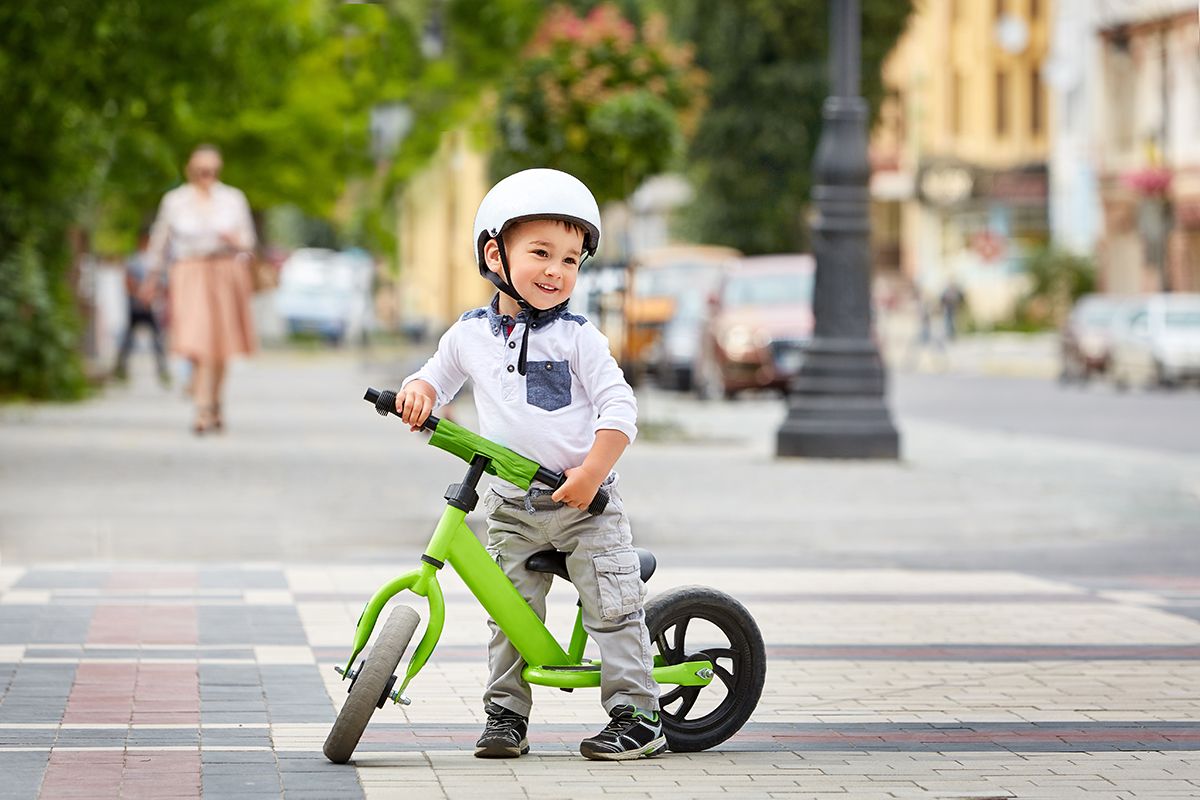 Little,Boy,Kid,In,Helmet,Ride,A,Bike,In,City