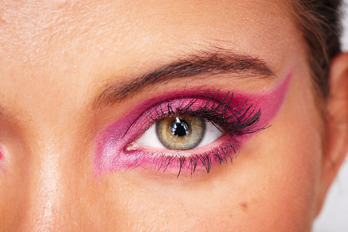 A young woman wearing pink eyeshadow