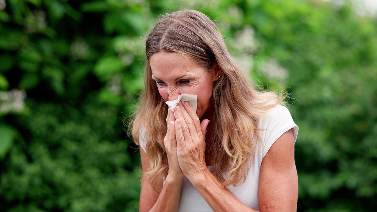 Allergic,Nose,And,Pollen,Allergy.,Sneezing,Into,Handkerchief