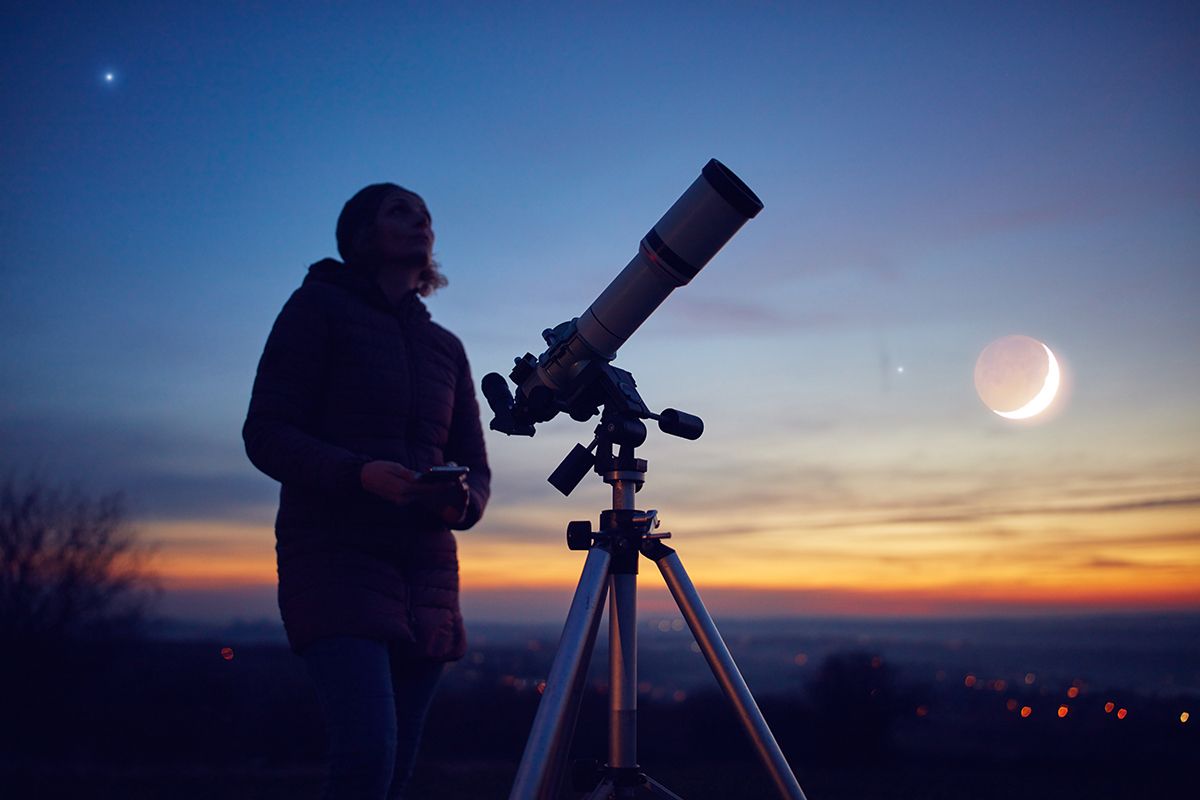Woman,Looking,At,Night,Sky,With,Amateur,Astronomical,Telescope.