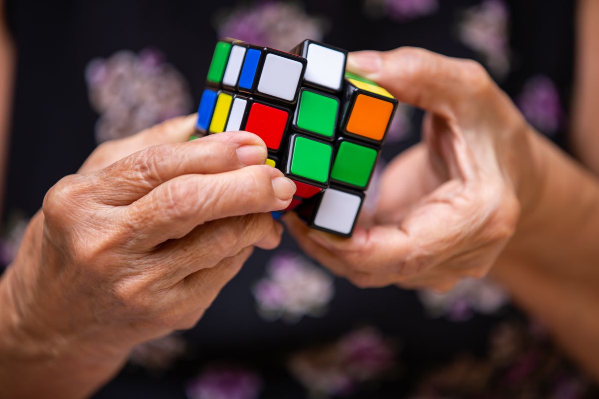 Bangkok,,Thailand,,27,July,2019,,Old,Woman,Holding,Rubik's,Cube
