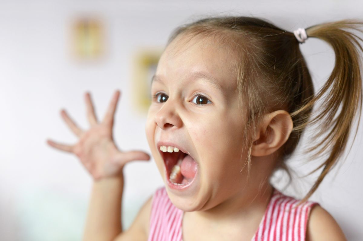 Portrait,Of,Emotional,Little,Girl,In,A,Pink,At,Home