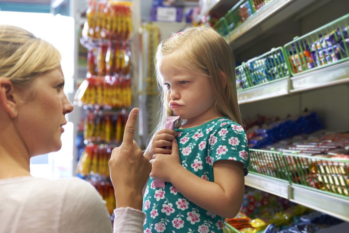 Child,Having,Argument,With,Mother,At,Candy,Counter