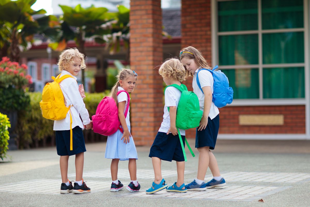 Child,Going,To,School.,Boy,And,Girl,Holding,Books,And