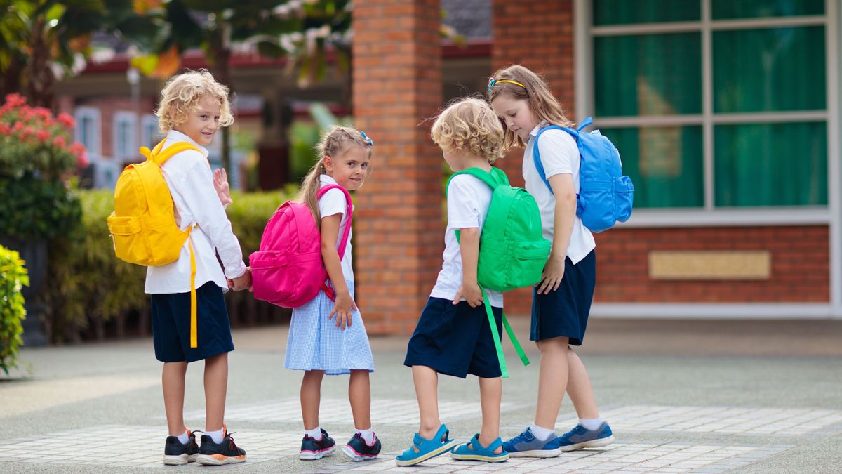 Child,Going,To,School.,Boy,And,Girl,Holding,Books,And