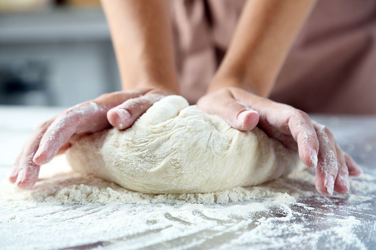 Making,Dough,By,Female,Hands,At,Bakery