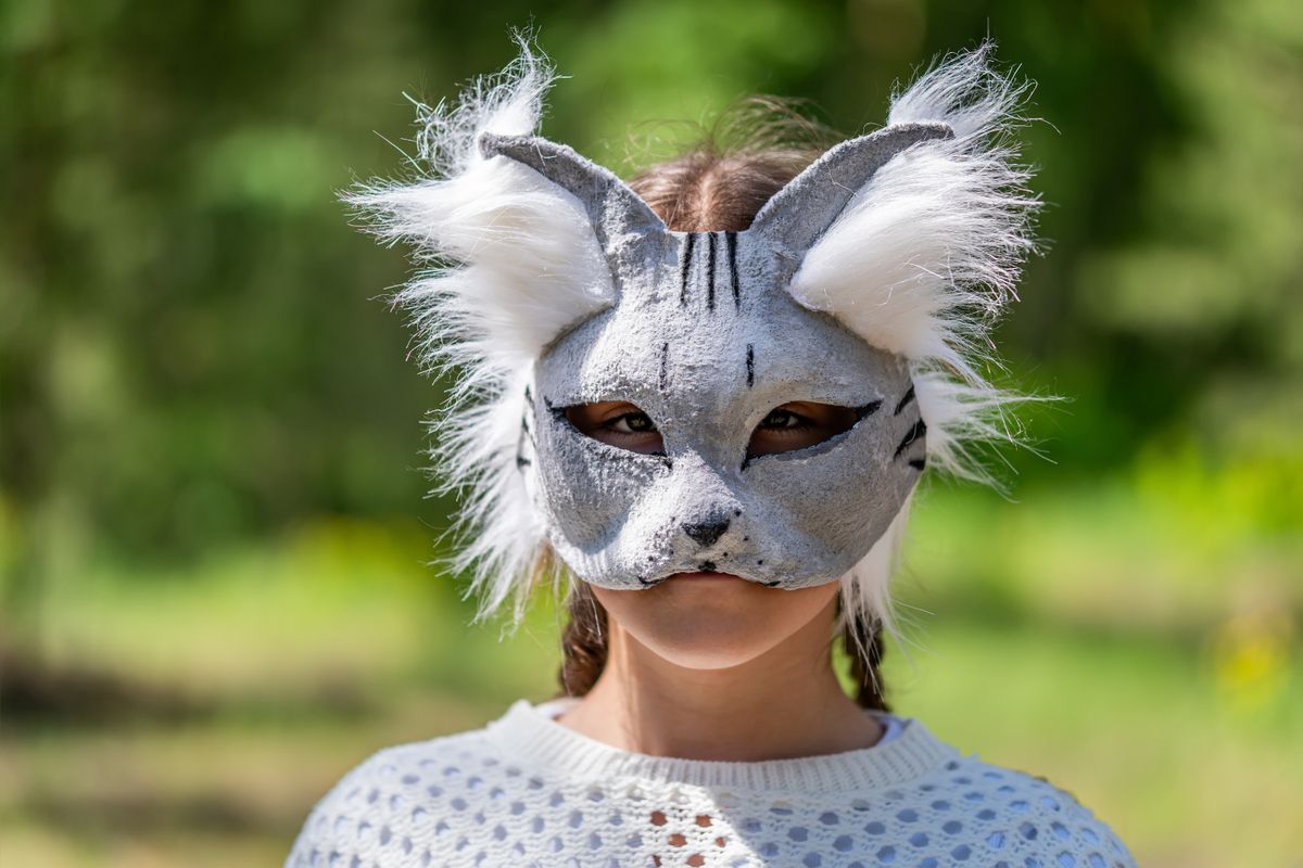 A,Girl,In,A,Cat,Mask,On,The,Background,Of