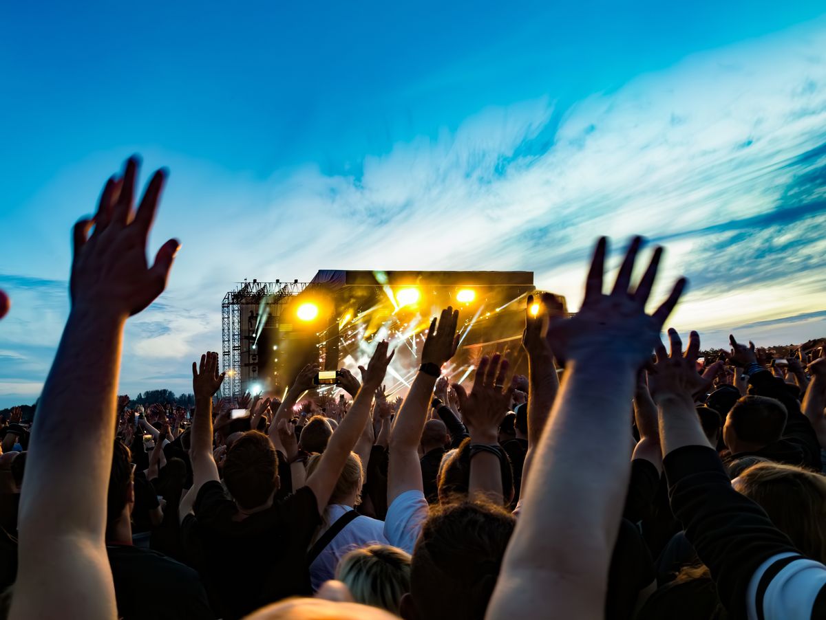 Cheering,Crowd,At,A,Rock,Concert,At,Dusk