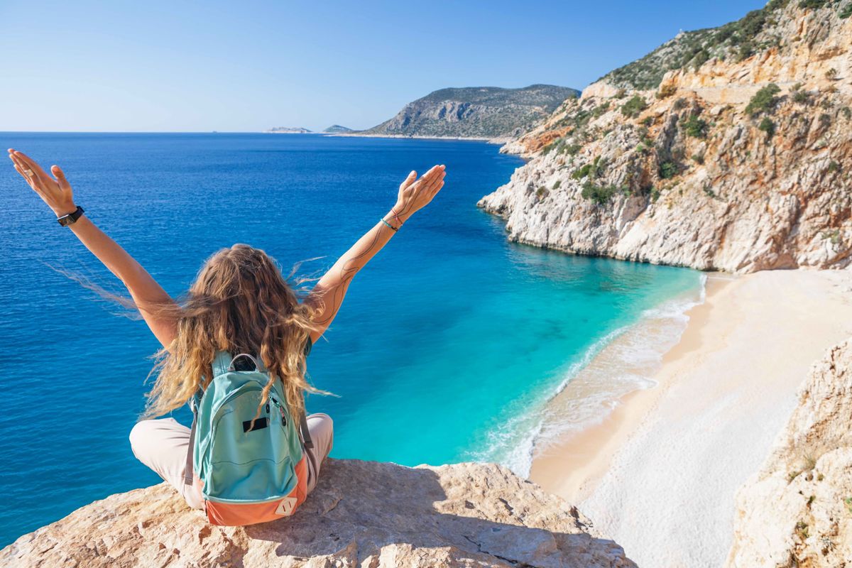 Young,Woman,With,Backpack,Looking,Out,Over,Kaputas,Beach,,Lycia