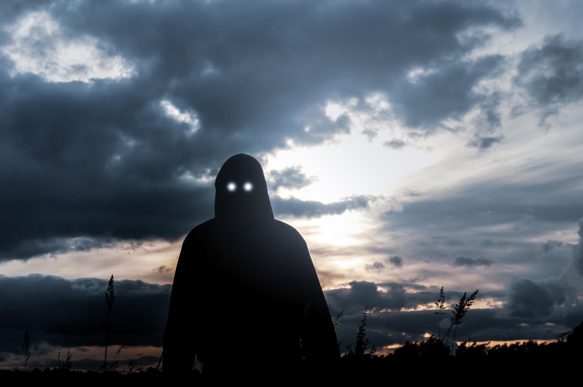 A,Horror,Concept.,A,Silhouette,Of,A,Hooded,Figure,,Standing