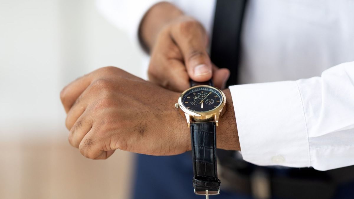 African American businessman wearing expensive wrist watch